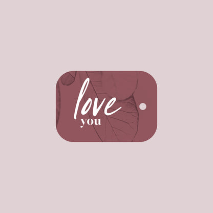 Product afbeelding van een oud-roze boeket kaartje met daarop de tekst "love you" met een licht roze achtergrond.
